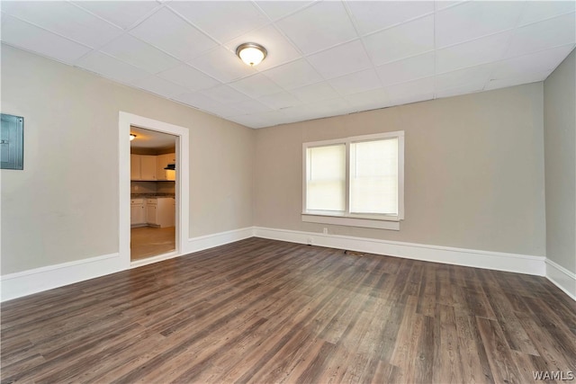 spare room featuring dark hardwood / wood-style floors