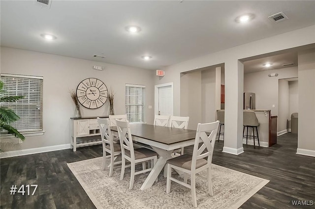 dining space with dark wood finished floors, visible vents, recessed lighting, and baseboards