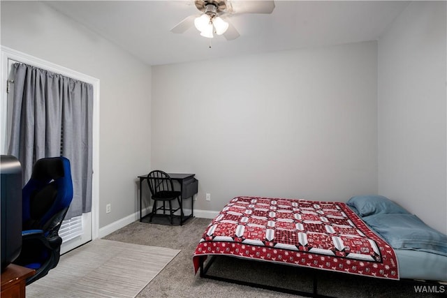 carpeted bedroom featuring a ceiling fan and baseboards