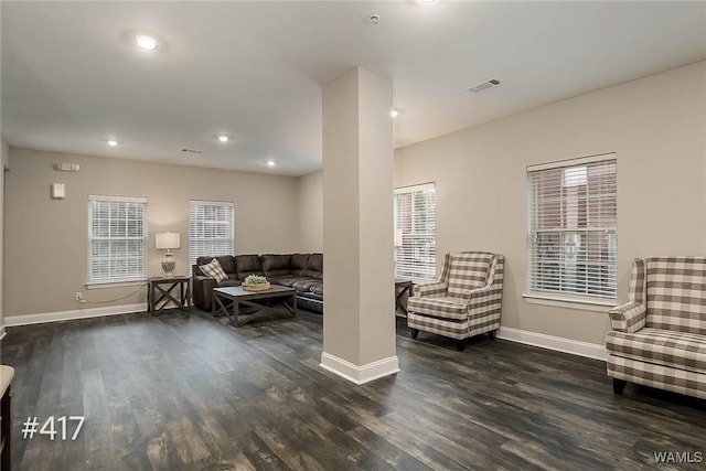 living room with visible vents, recessed lighting, baseboards, and wood finished floors