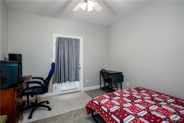 carpeted bedroom featuring baseboards and ceiling fan