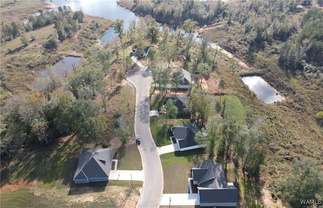 drone / aerial view with a water view