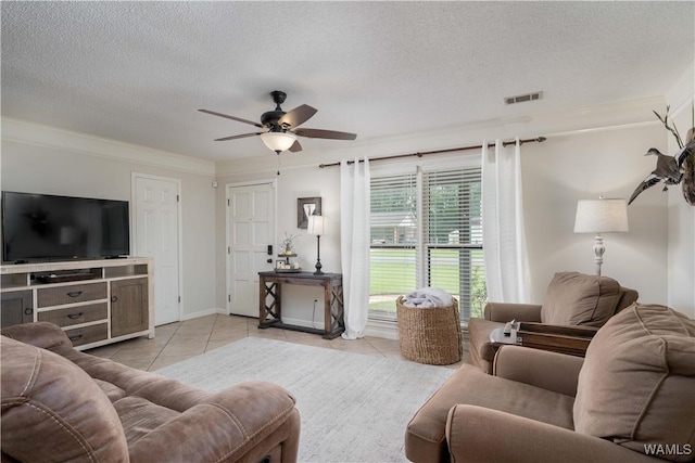 850 Walnut Dr, Tuscaloosa, AL 35405 - tiled living area with a ceiling fan, a textured ceiling, crown molding, and baseboards