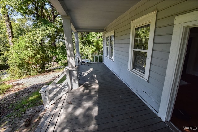 wooden deck featuring covered porch