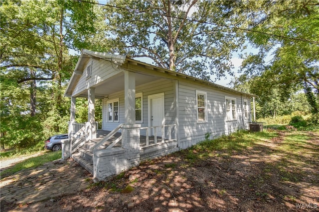 view of front facade featuring central AC and covered porch