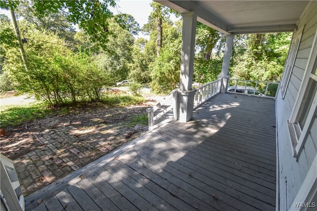 wooden terrace featuring a porch