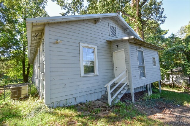 back of property with central AC