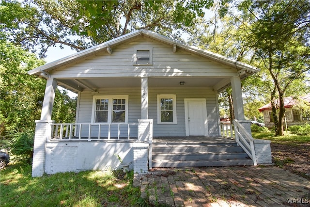 bungalow-style house featuring covered porch