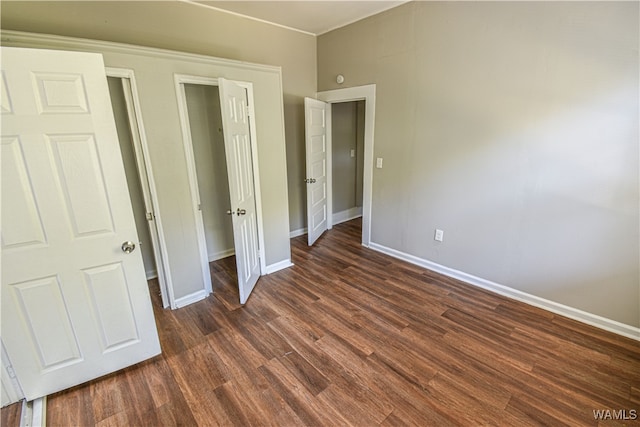 unfurnished bedroom featuring dark hardwood / wood-style floors