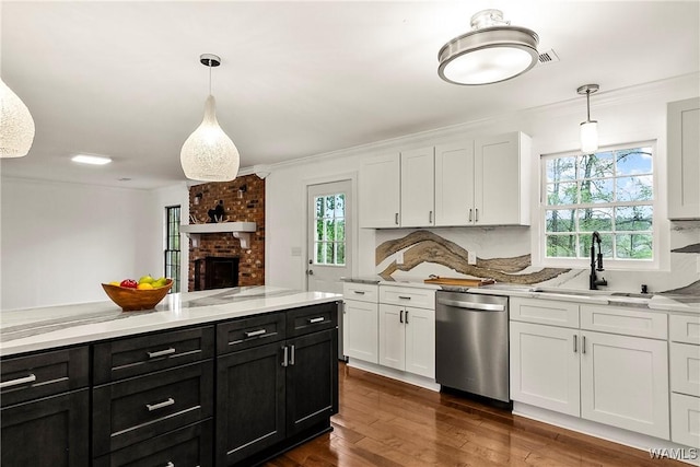 600 Innsbruck Ct, Northport, AL 35473 - kitchen featuring dishwasher, dark cabinetry, white cabinets, light countertops, and crown molding