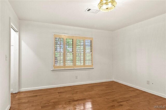 600 Innsbruck Ct, Northport, AL 35473 - unfurnished room with wood finished floors and baseboards