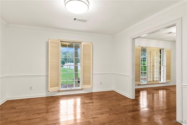 600 Innsbruck Ct, Northport, AL 35473 - unfurnished room featuring wood finished floors and crown molding