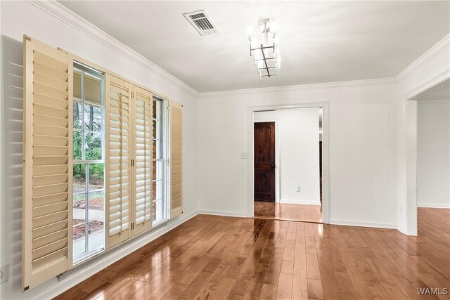 600 Innsbruck Ct, Northport, AL 35473 - unfurnished room featuring wood finished floors and crown molding