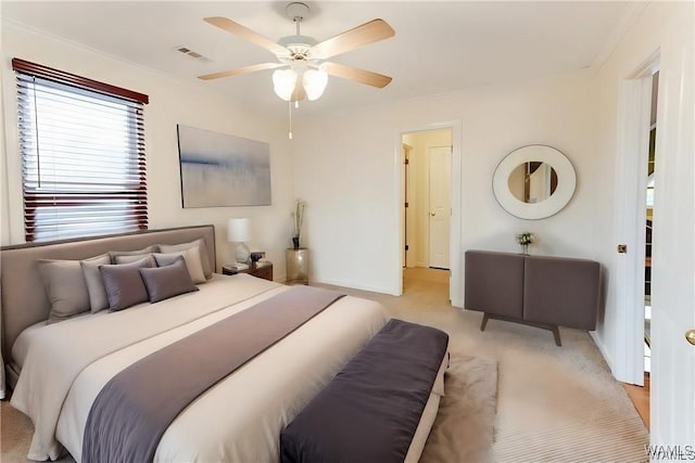 bedroom with ceiling fan and light carpet