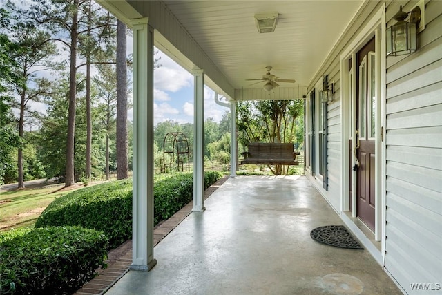 view of patio featuring ceiling fan and a porch