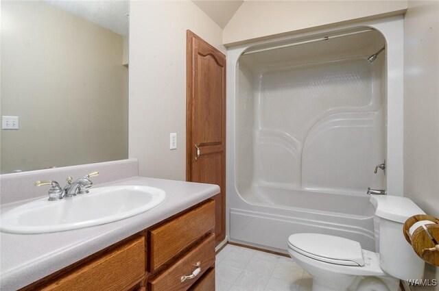 full bathroom featuring vanity, toilet, lofted ceiling, and shower / washtub combination