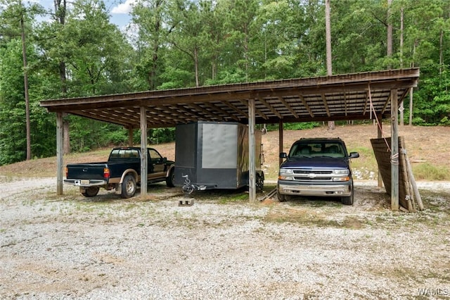 view of parking / parking lot featuring a carport