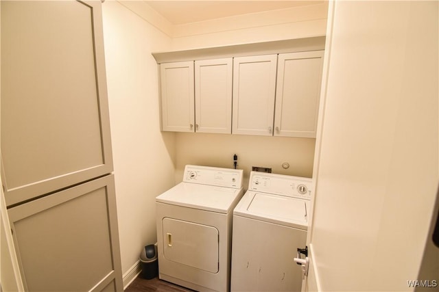 laundry room featuring washing machine and dryer and cabinet space