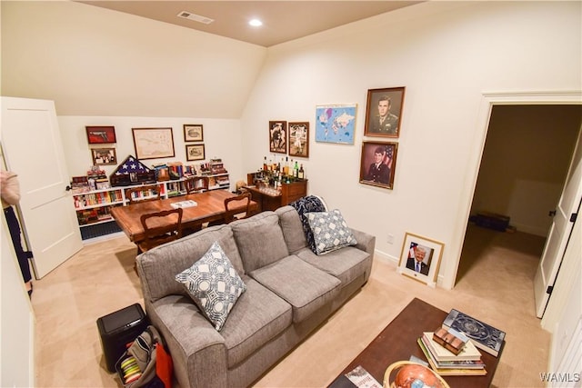 living area with carpet floors, recessed lighting, visible vents, and lofted ceiling