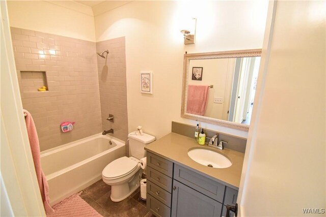 full bath featuring  shower combination, vanity, toilet, and tile patterned floors