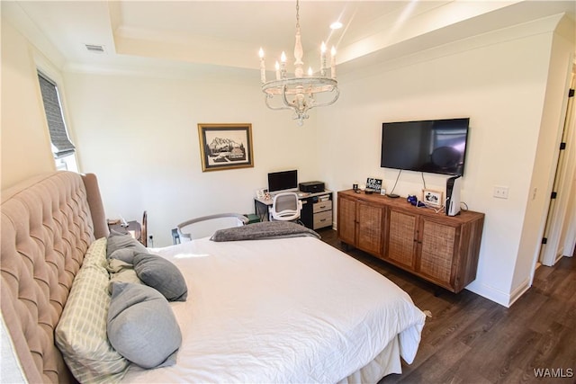 bedroom featuring a chandelier, visible vents, baseboards, dark wood finished floors, and a raised ceiling