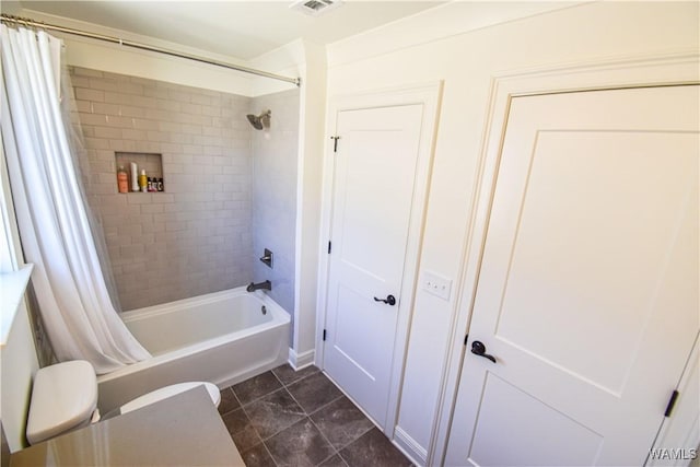 bathroom featuring visible vents and shower / tub combo with curtain