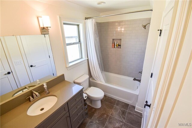 bathroom with vanity, toilet, and shower / bath combo with shower curtain