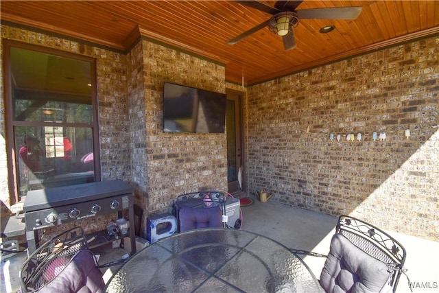 view of patio with a ceiling fan and outdoor dining space