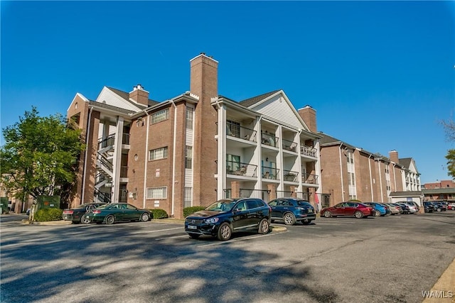 708 11th St Unit 318, Tuscaloosa, AL 35401 - view of apartment building / complex featuring uncovered parking