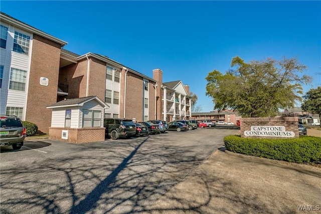708 11th St Unit 318, Tuscaloosa, AL 35401 - view of building exterior featuring uncovered parking and a residential view