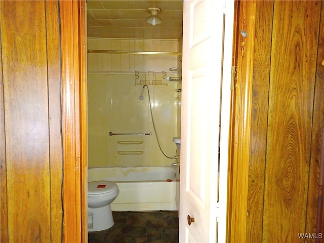 bathroom with toilet and tub / shower combination