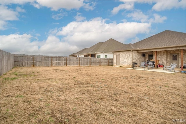 view of yard with a patio area