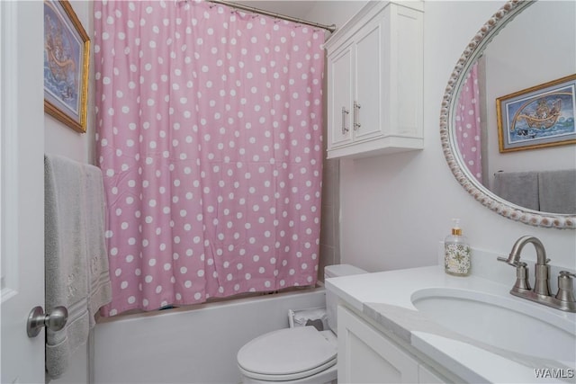 full bathroom with vanity, toilet, and  shower combination