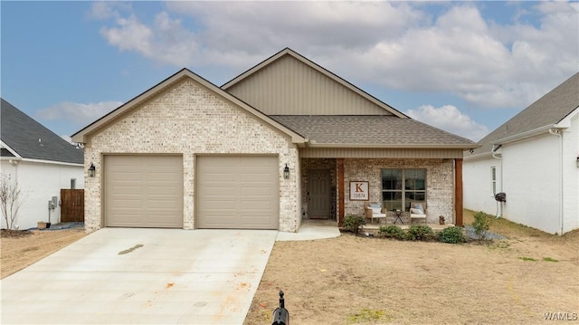 view of front of home featuring a garage and covered porch