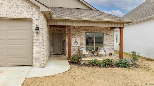 view of exterior entry with a garage