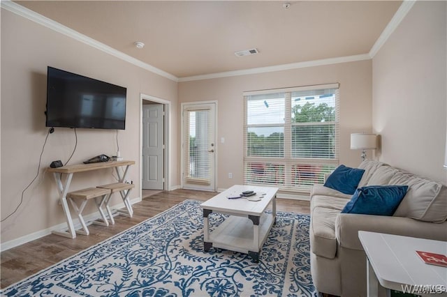 living room with wood-type flooring and ornamental molding