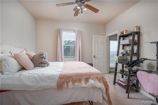 bedroom with ceiling fan and light colored carpet