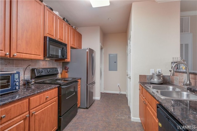 kitchen with tasteful backsplash, dark stone countertops, sink, and black appliances