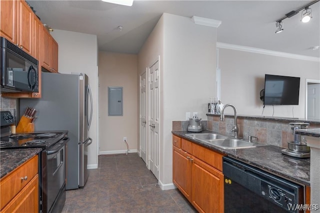 kitchen featuring sink, crown molding, dark stone counters, decorative backsplash, and black appliances