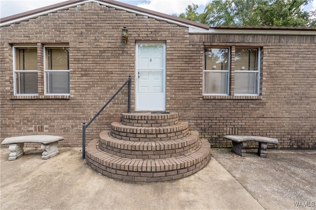 rear view of property featuring a patio