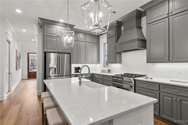 301 Trails End Ln, Tuscaloosa, AL 35406 - kitchen with stainless steel appliances, an inviting chandelier, a sink, and gray cabinetry