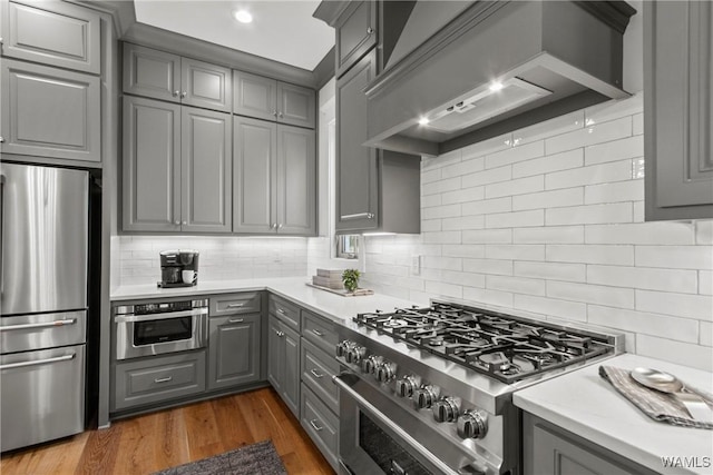 301 Trails End Ln, Tuscaloosa, AL 35406 - kitchen featuring premium range hood, gray cabinetry, stainless steel appliances, and light countertops