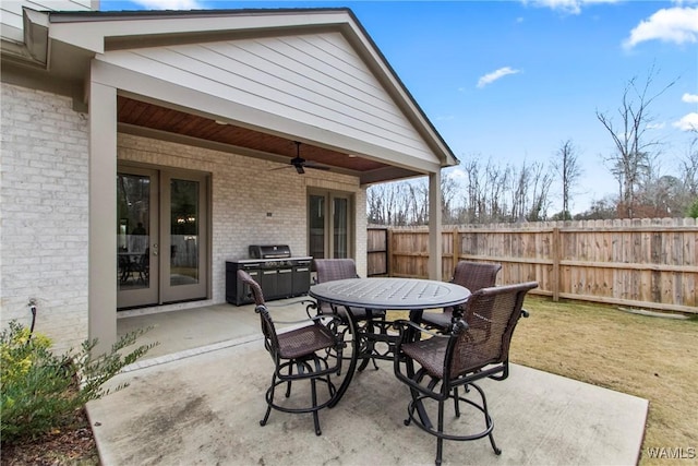 301 Trails End Ln, Tuscaloosa, AL 35406 - view of patio featuring outdoor dining area, fence, a ceiling fan, and french doors