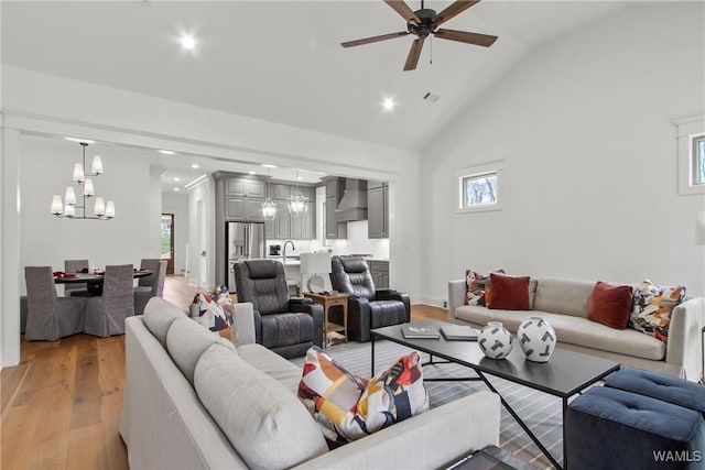 301 Trails End Ln, Tuscaloosa, AL 35406 - living area featuring light wood finished floors, a healthy amount of sunlight, recessed lighting, and ceiling fan with notable chandelier