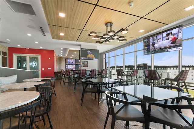 1150 8th St Unit 314, Tuscaloosa, AL 35401 - dining space with floor to ceiling windows, wood finished floors, and a chandelier