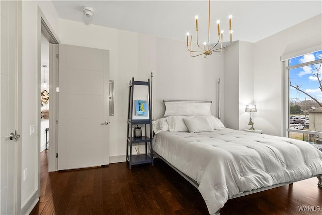 1150 8th St Unit 314, Tuscaloosa, AL 35401 - bedroom with hardwood / wood-style floors and a chandelier