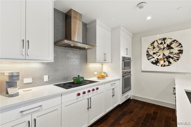 1150 8th St Unit 314, Tuscaloosa, AL 35401 - kitchen featuring wall chimney exhaust hood, cooktop, light countertops, and dark wood finished floors