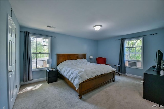 4401 Nicholas Ave, Northport, AL 35473 - bedroom featuring baseboards, light carpet, and cooling unit