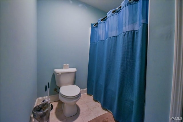 4401 Nicholas Ave, Northport, AL 35473 - bathroom with toilet, tile patterned flooring, and a shower with shower curtain