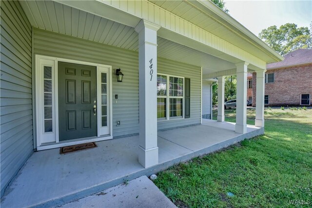 4401 Nicholas Ave, Northport, AL 35473 - property entrance with a porch and a lawn